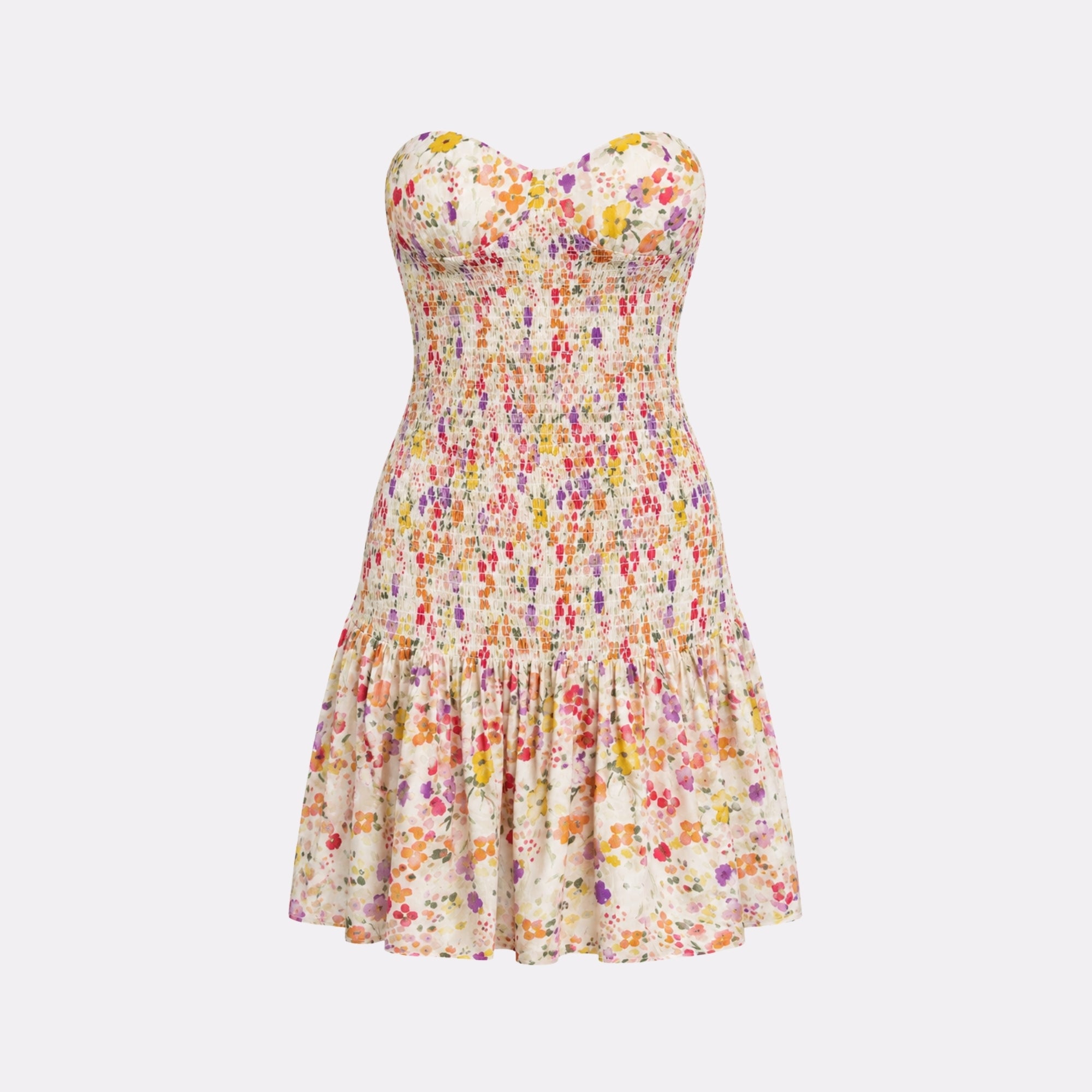 Flat lay studio product shot of the white floral strapless mini dress featuring vibrant yellow, pink, and purple blossom prints.