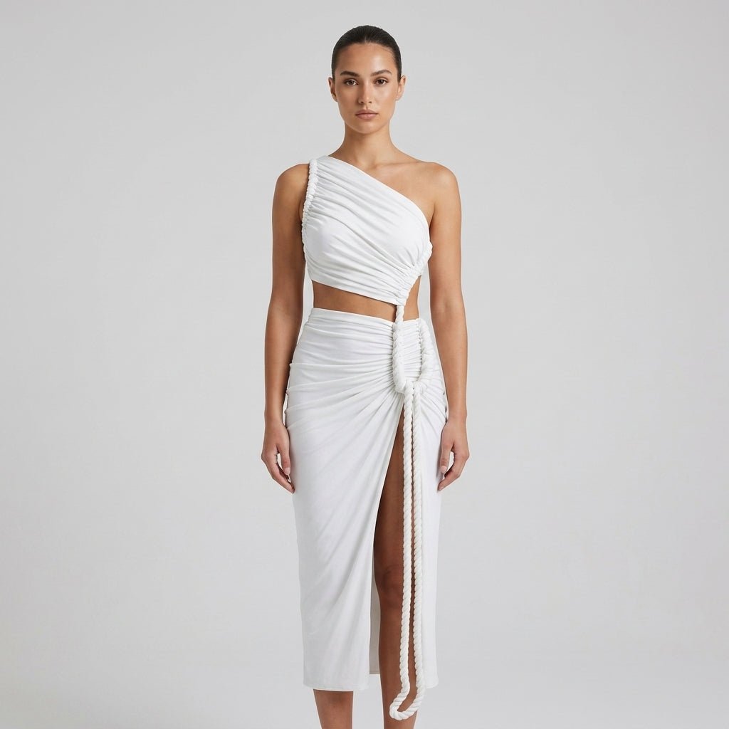 Close up styled view of the Kouvr white resort wear maxi dress highlighting the twisted rope waist detail and draped stretch knit fabric.
