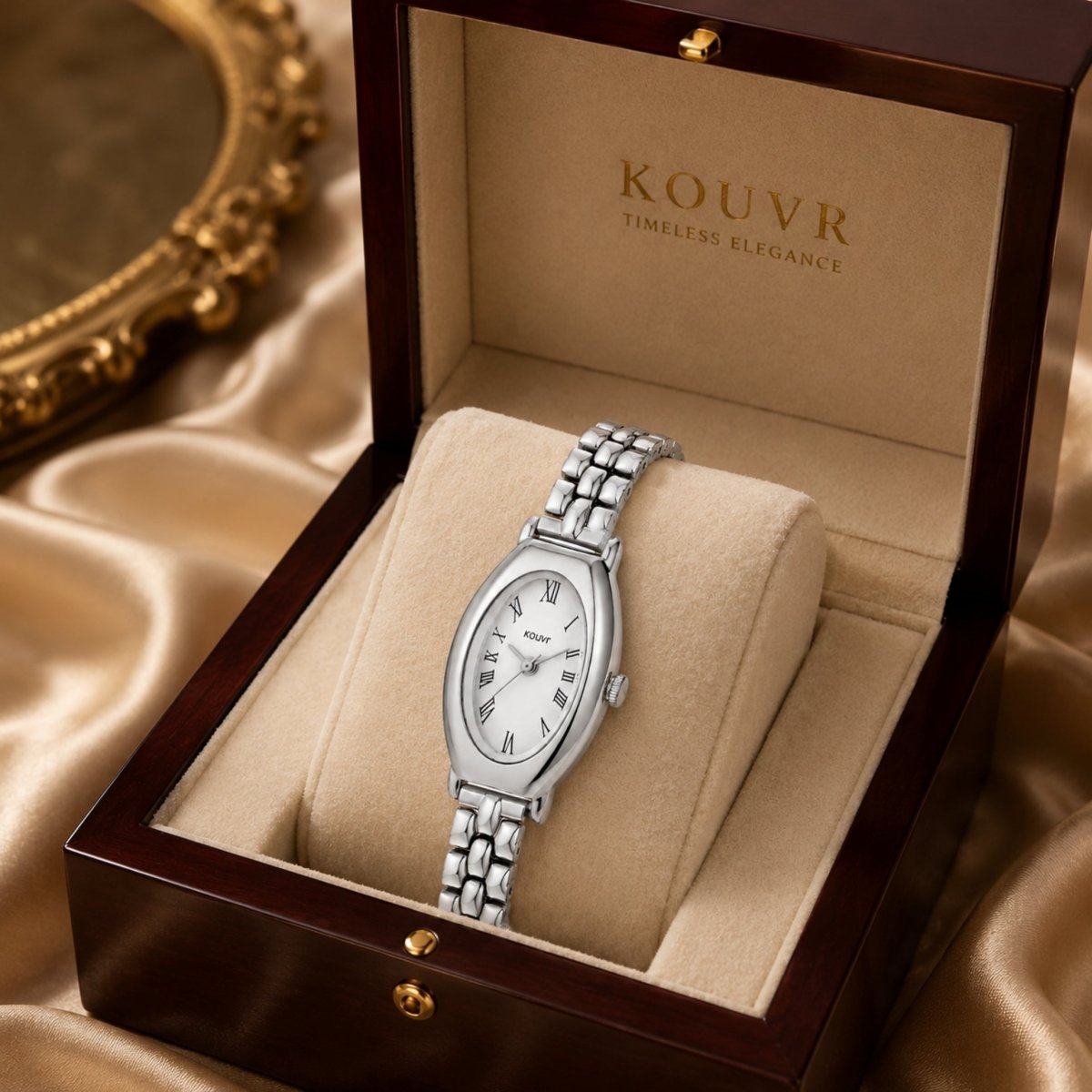 Kouvr silver women's jewelry watch displayed inside a premium mahogany wooden presentation box with cream velvet interior.