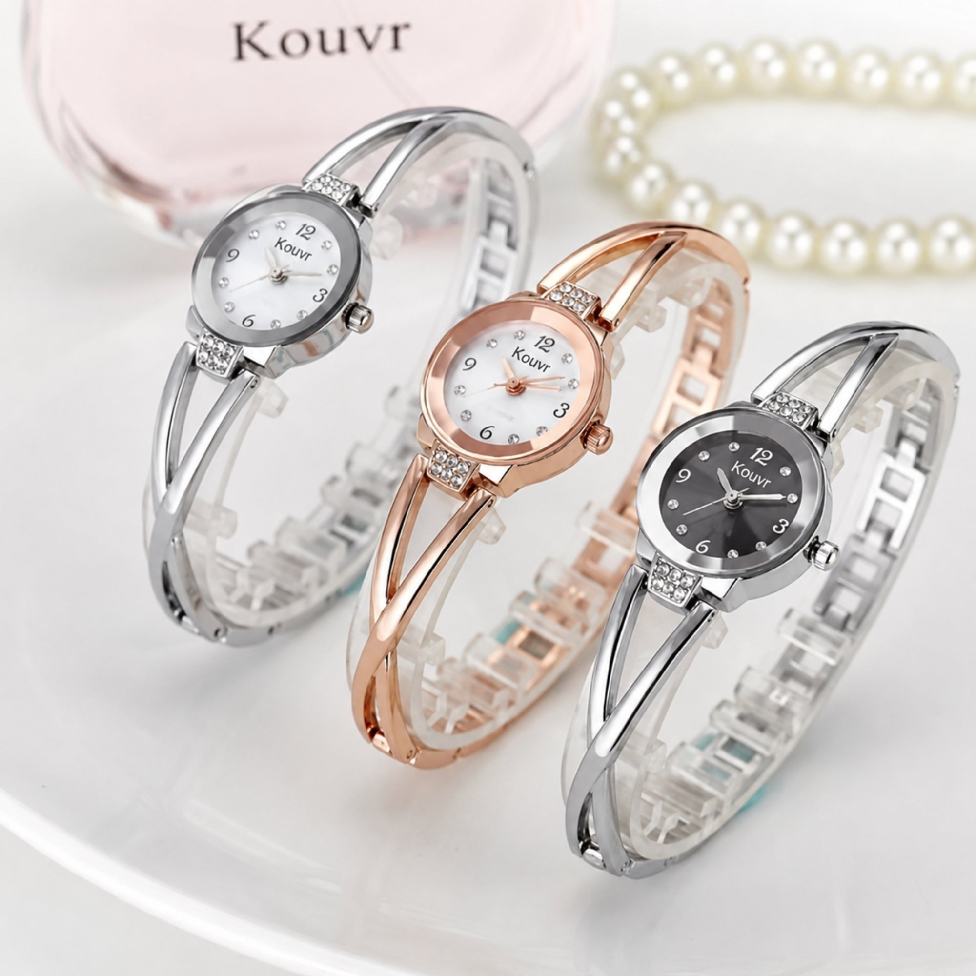 Stunning collection of Kouvr women's bangle watches in silver and rose gold finishes highlighting the sophisticated crossover band design.