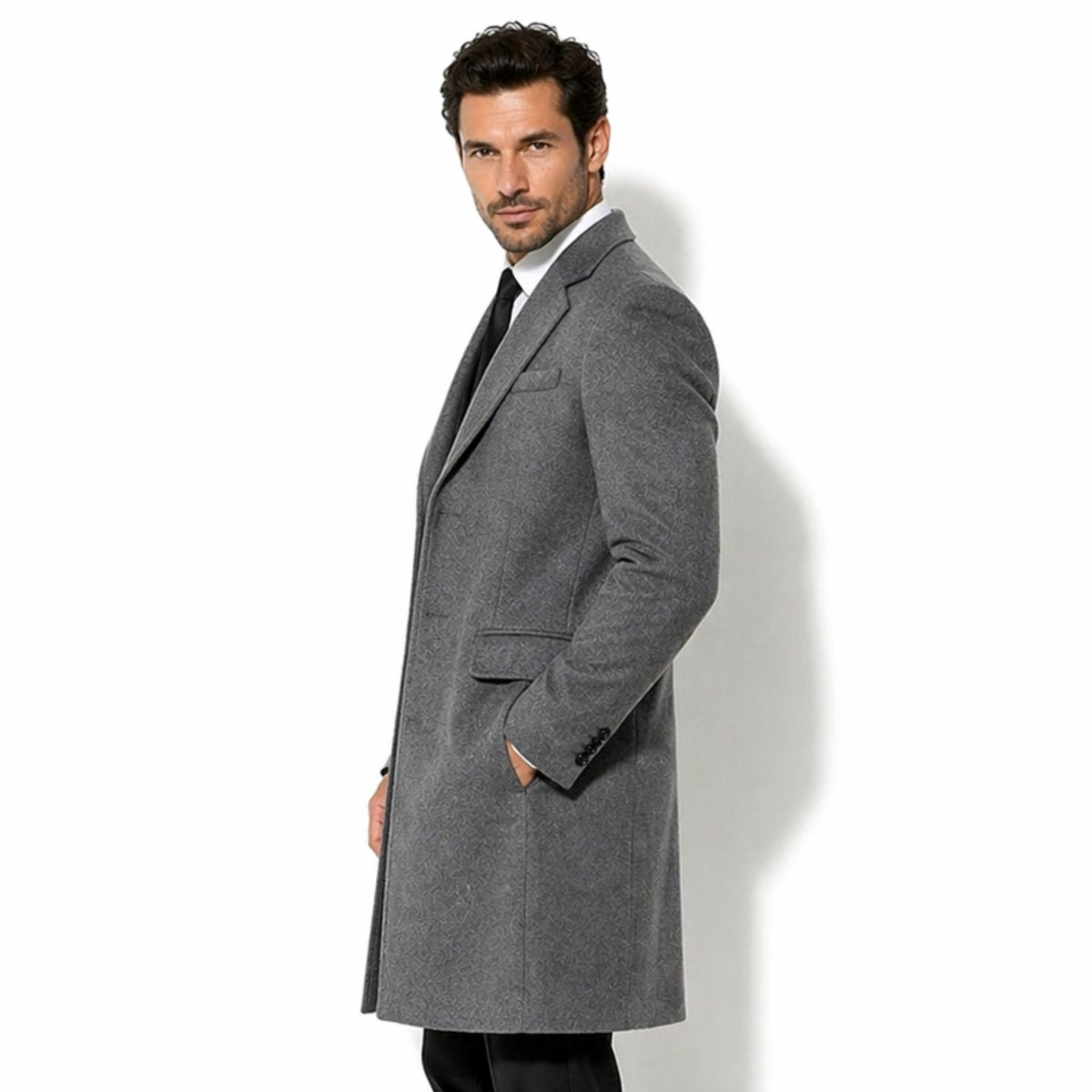 Side profile of Kouvr men's slim fit grey winter dress coat showcasing the structured shoulder, tonal jacquard pattern, and flap pocket detailing.