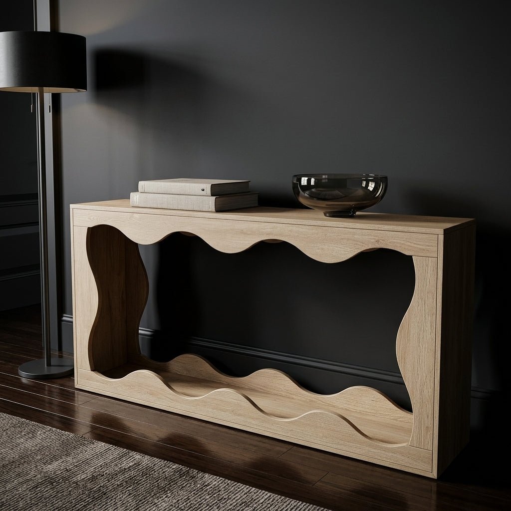 Moody luxury interior design featuring a brightly toned solid oak sculptural wave console table standing out dramatically against a stark matte black hallway wall.