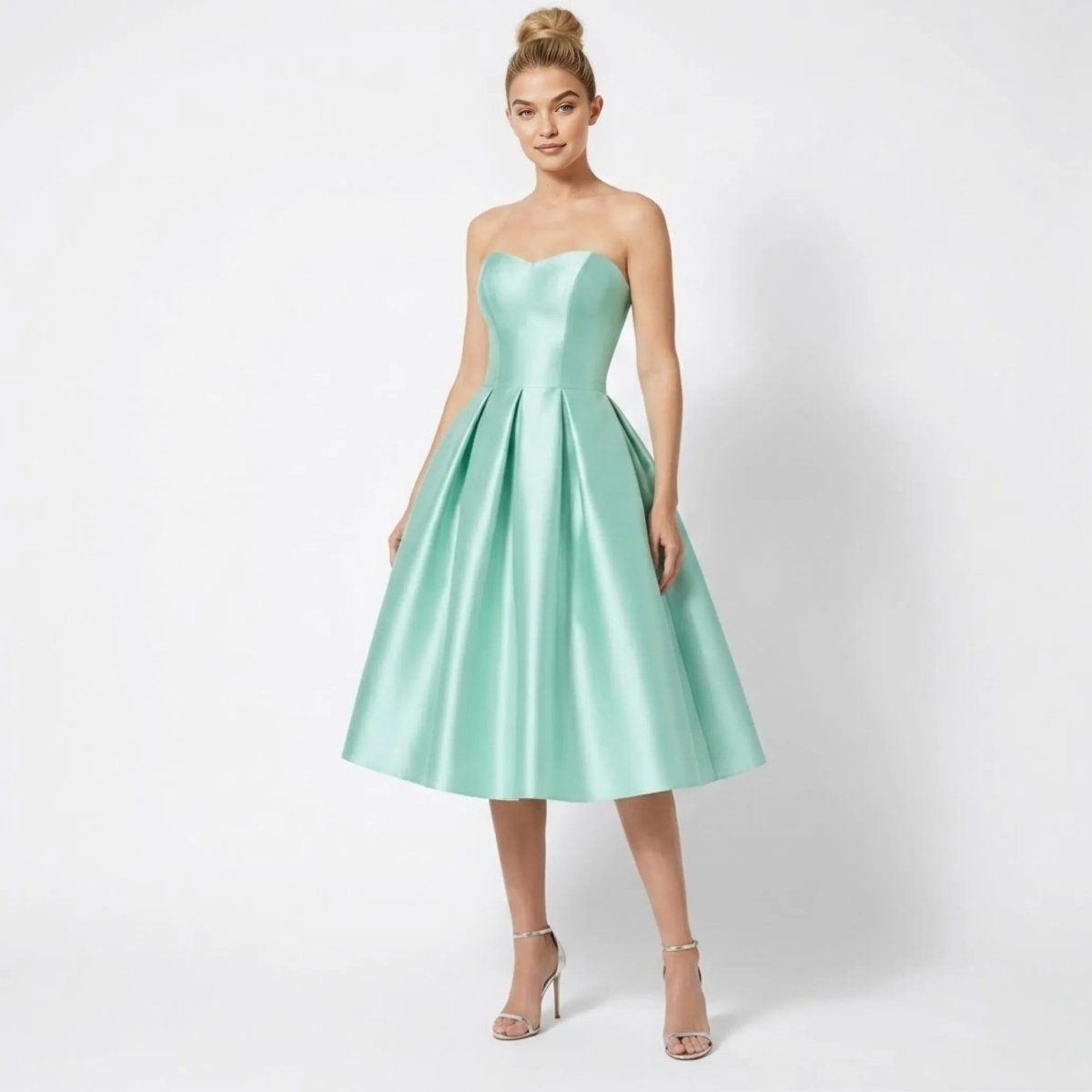 Front view of model wearing Kouvr mint green satin strapless sweetheart A-line midi cocktail dress