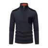 Flat lay product shot of a navy blue men's quarter-zip sweater showing the black shoulder patches, chest pocket, and orange interior trim.