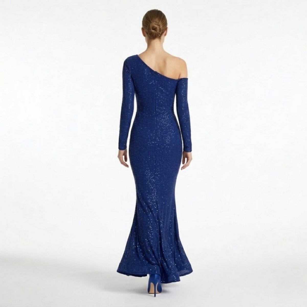 Back view of the Kouvr formal mermaid prom dress showing off-the-shoulder sleeve detail and floor-length hem.