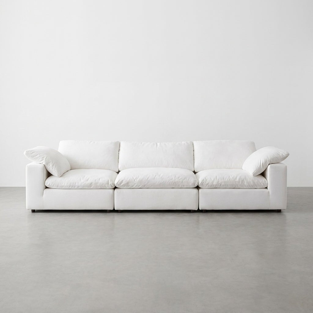 Clean studio shot of the 3-seater white modular deep seat sofa against a solid white wall.
