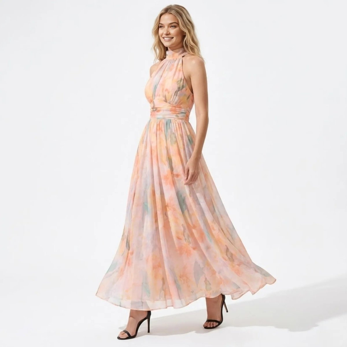 Side angle view of the flowing pastel watercolor chiffon maxi dress with ruched waist detail.