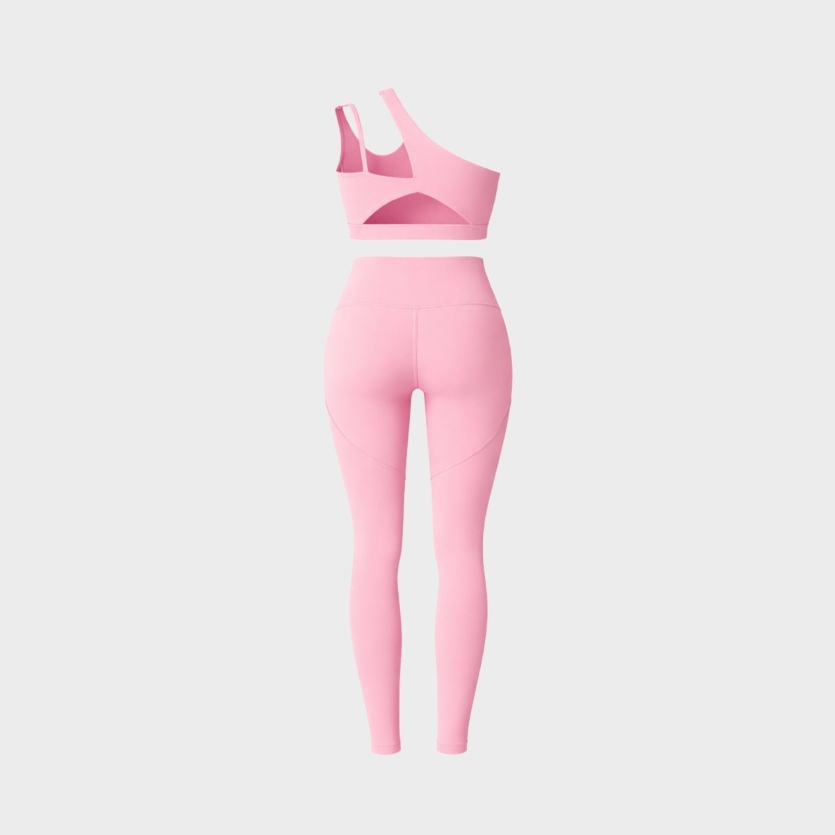 Flat lay back view of the pink activewear set showing the sports bra cutout and legging glute contouring seams.