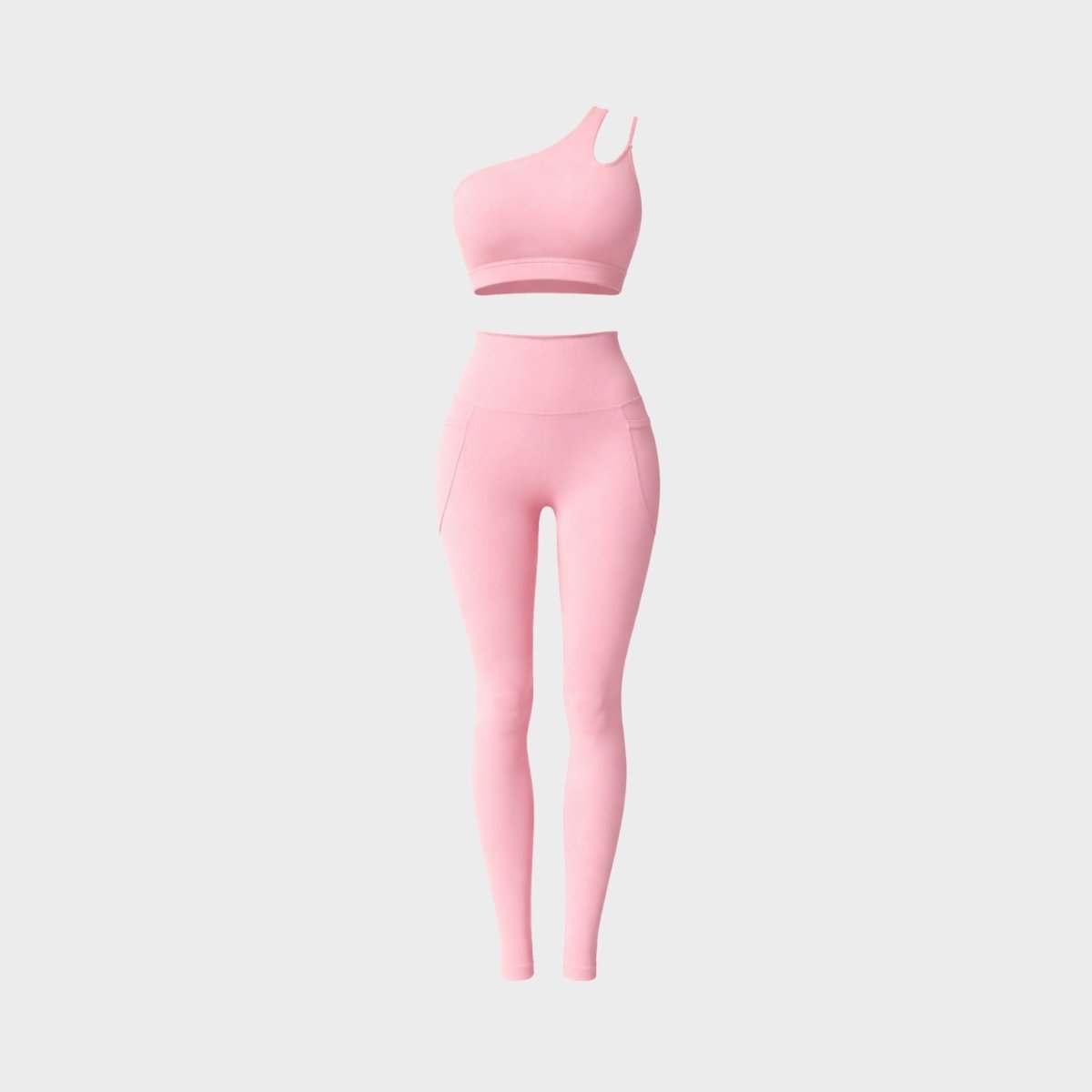 Clean studio ghost mannequin shot of the pink two-piece matching gym set featuring a one-shoulder crop top and pocket leggings.