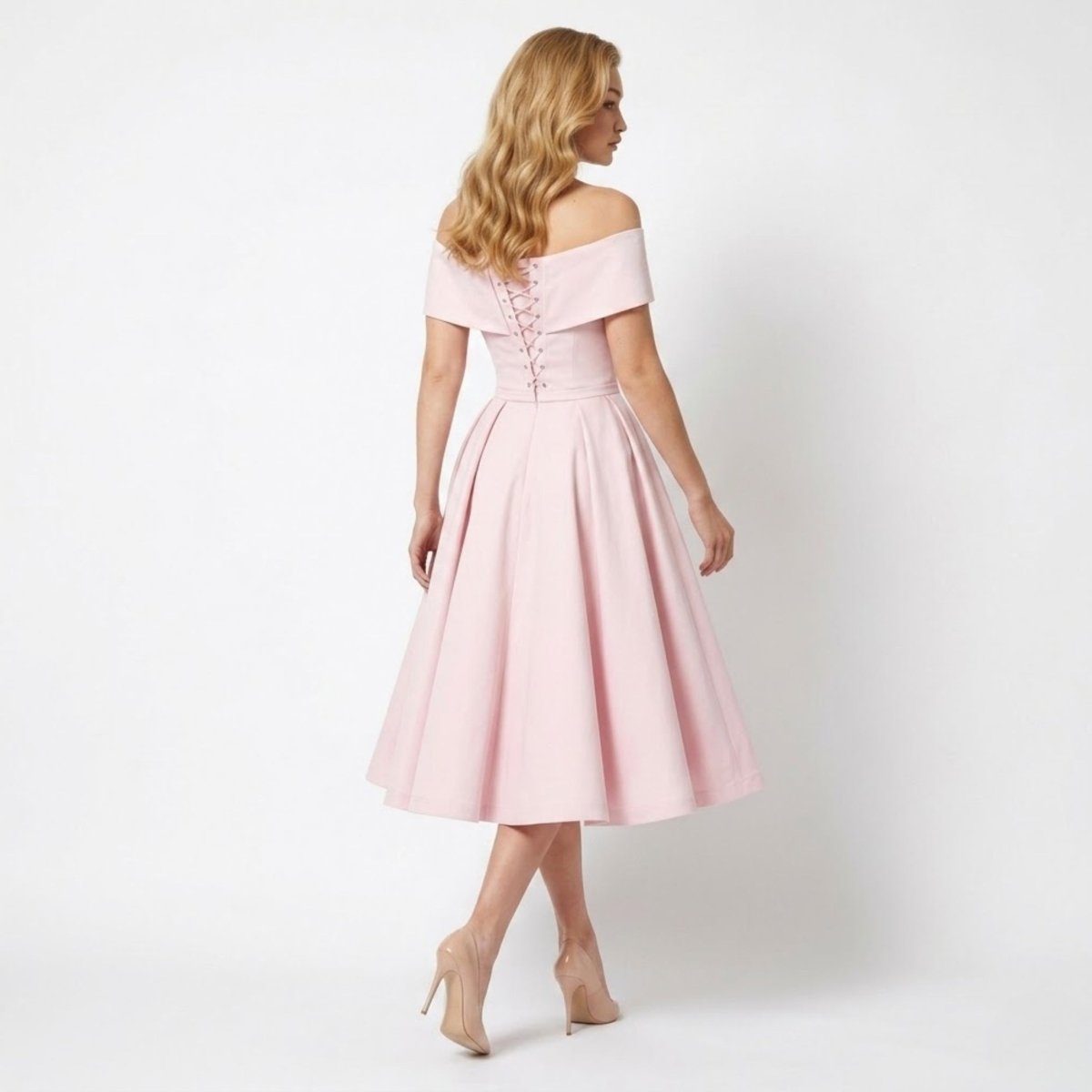 Back view of pink midi dress featuring adjustable lace-up corset detail