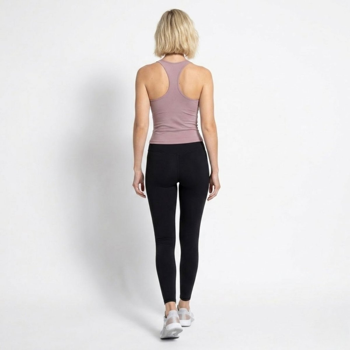 Flat lay studio image of the Kouvr purple scoop neck athletic tank top front view.