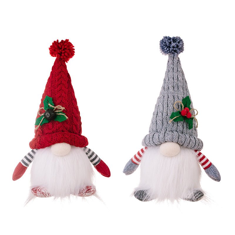 A pair of red and grey Christmas gnomes with a textured knit hat adorned with a bell and holly, featuring a full white beard on white background