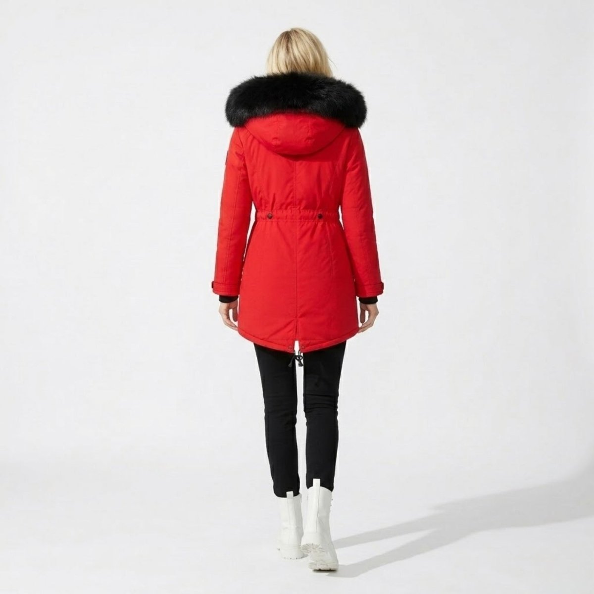 Back view of Kouvr red winter parka showing adjustable waist and fishtail hem