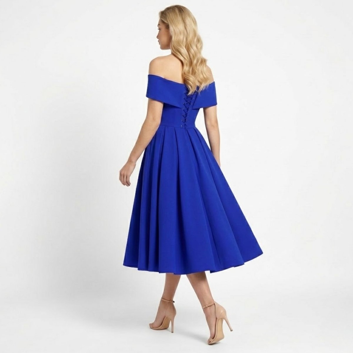 Back view of blue midi dress featuring corset lace up detail and pleated skirt