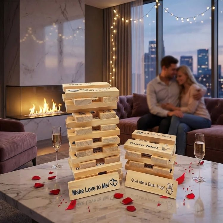A tall wooden tower of the "Make Love to Me" naughty block game set on a marble table in a luxury apartment with a city skyline view at sunset.
