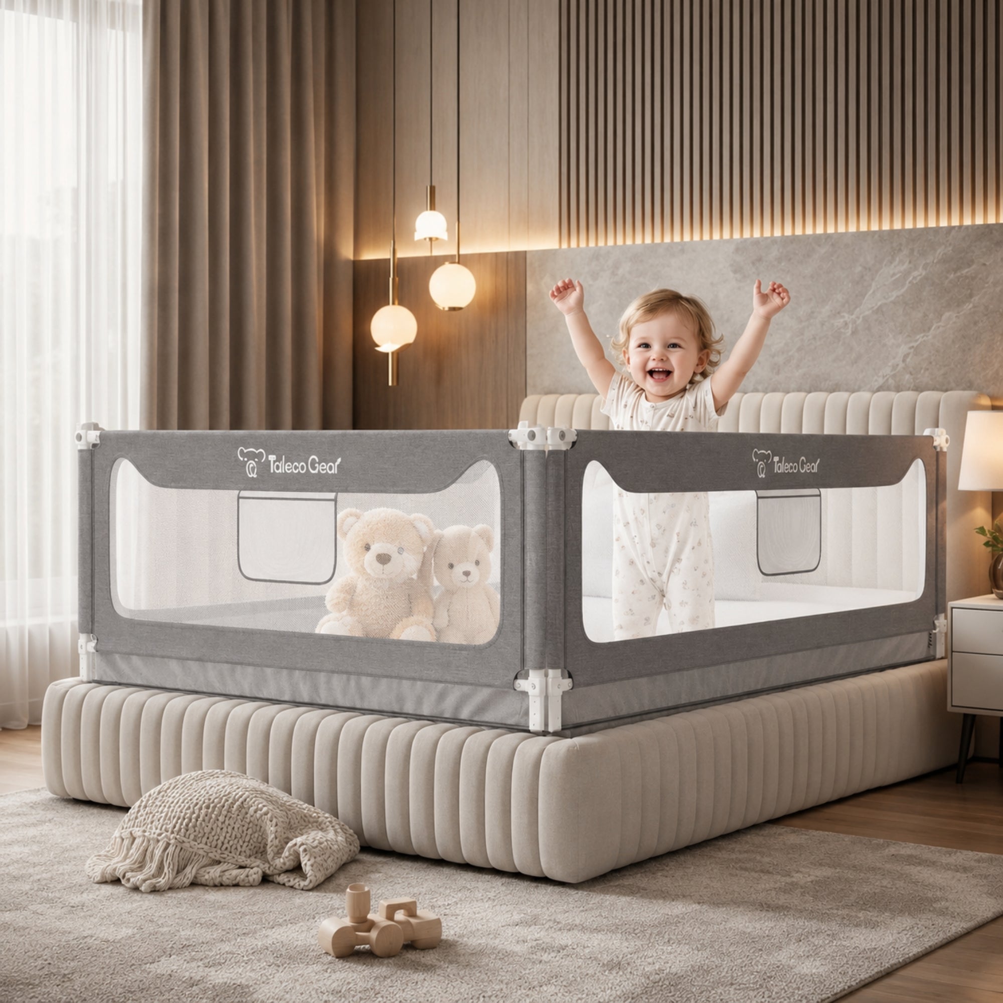 Kouvr SlumberHaven extra tall toddler bed rail guard enclosing a luxury upholstered bed with a happy child standing behind the protective grey mesh panel in a modern bedroom.