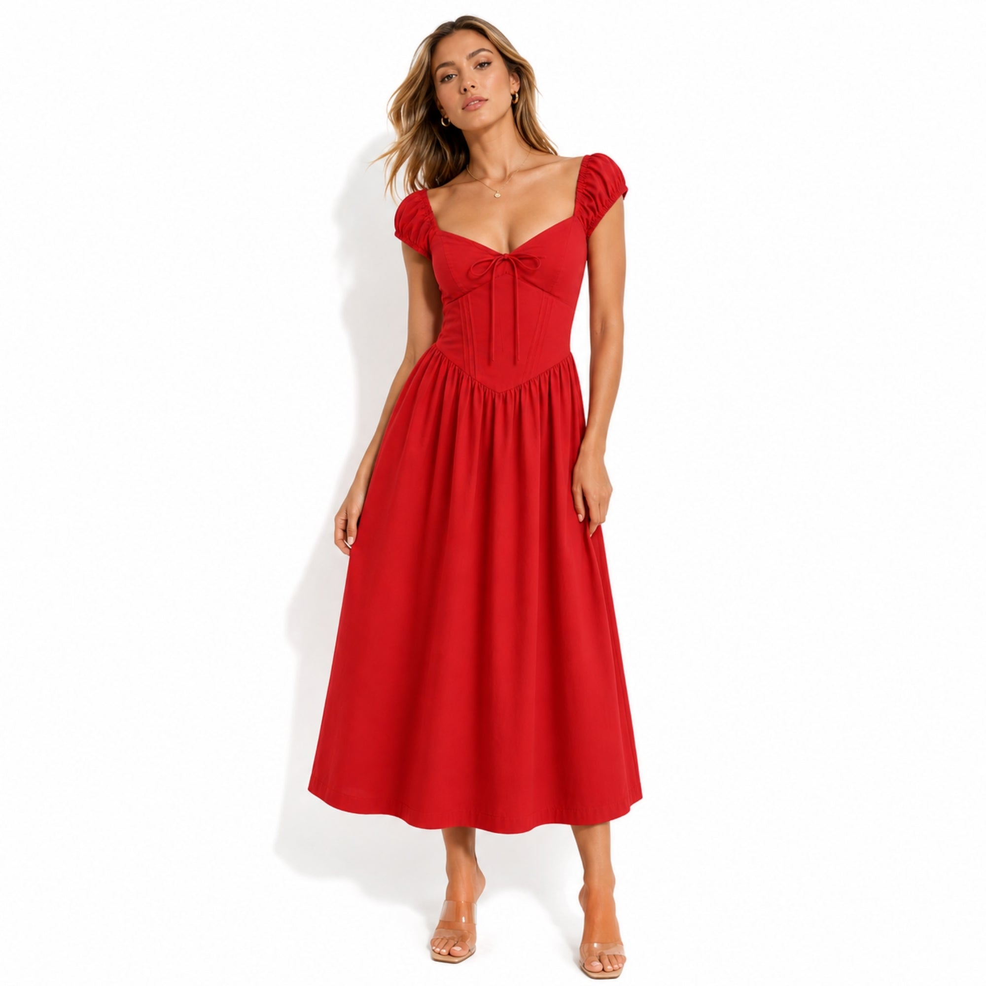 Woman wearing vibrant solid red A-line midi dress with cap sleeves and tie front bust