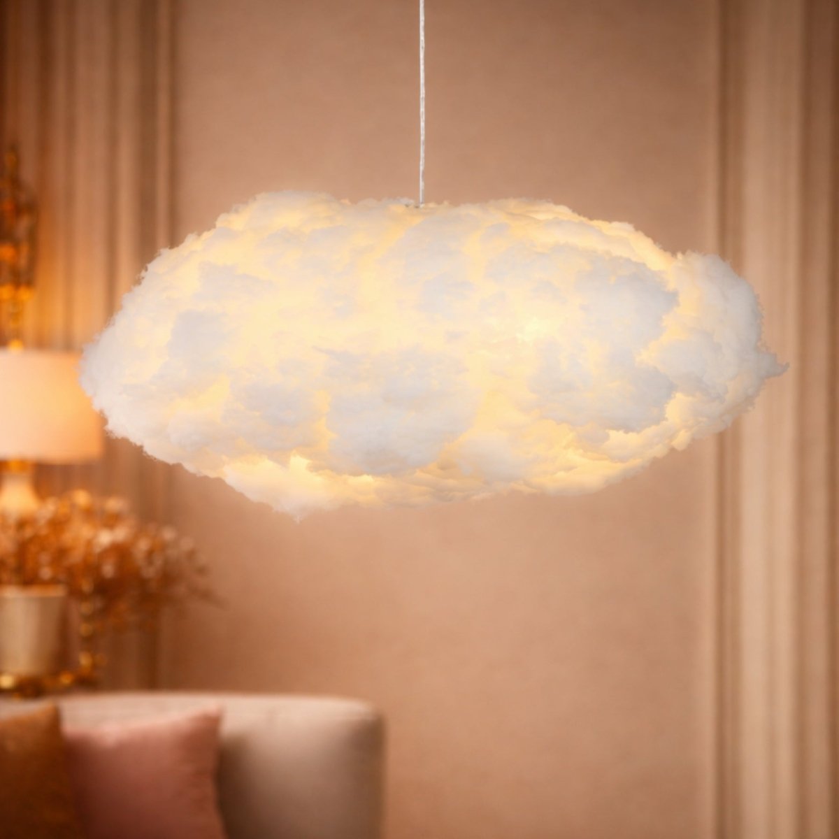 A single illuminated cloud hanging lamp emitting a warm, cozy yellow glow against a neutral interior wall.