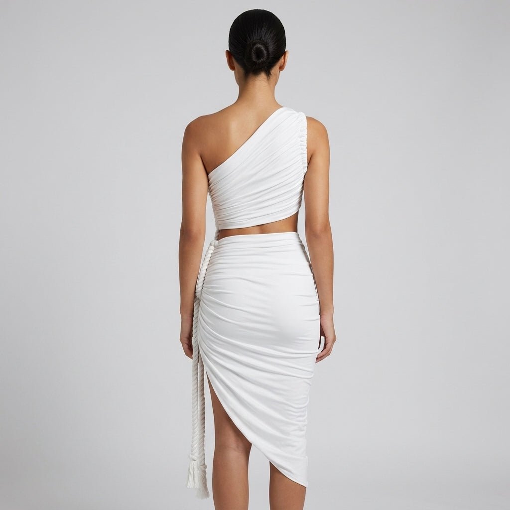 Back view of the Kouvr white asymmetrical cutout dress showing the one shoulder ruched back and side rope detail.