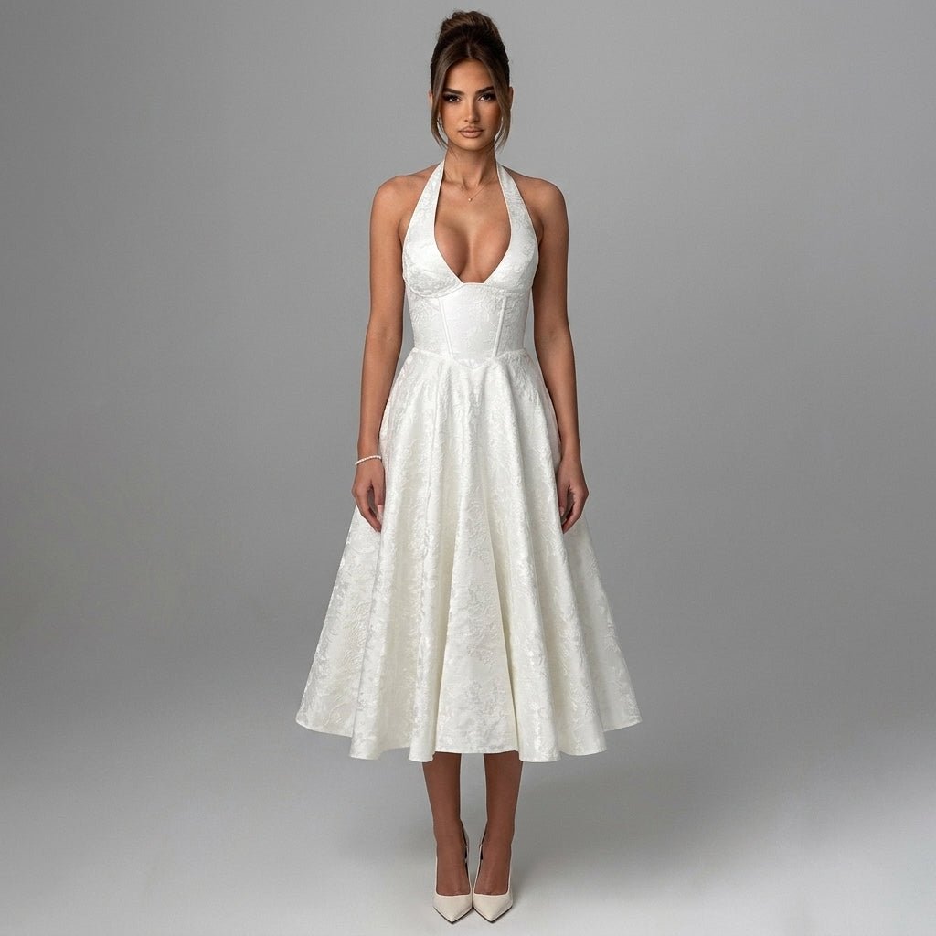 Front view of the Kouvr white halter corset midi dress featuring a plunging v-neckline and premium textured jacquard fabric.