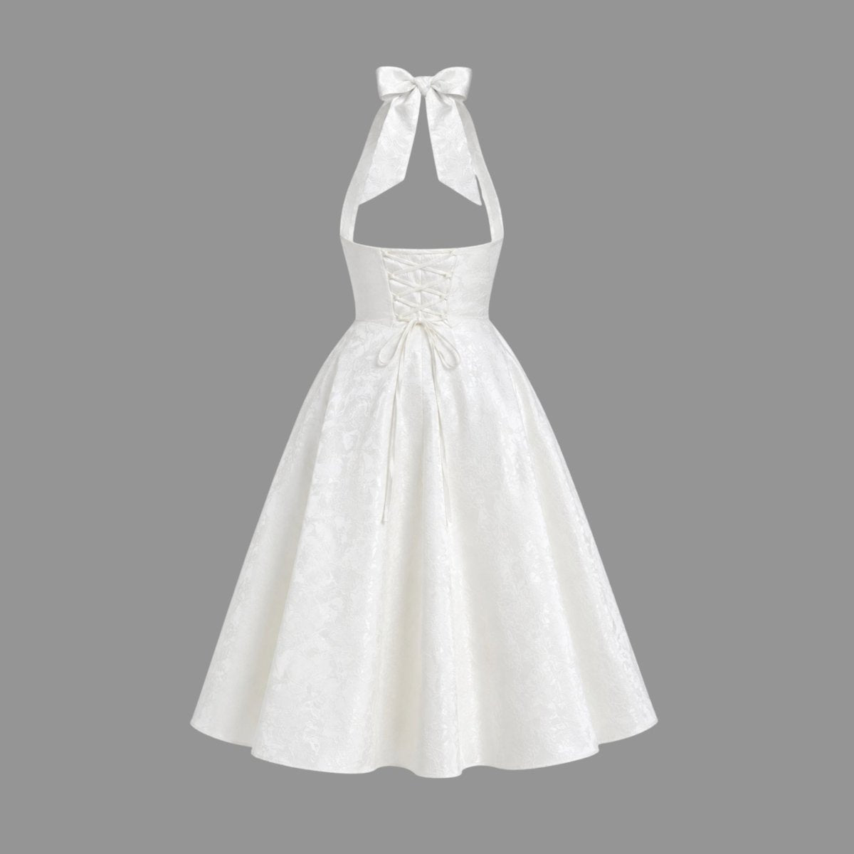 Ghost mannequin back view of the Kouvr white lace-up corset midi dress showing the functional ties and open back design.