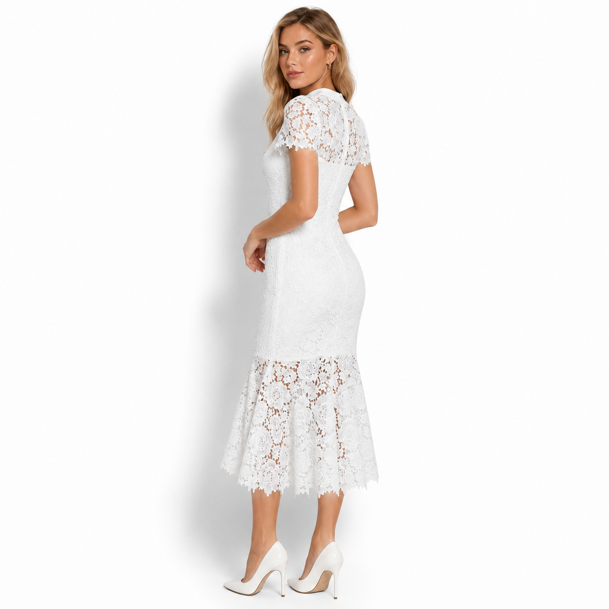 Side back view of women's fitted white lace trumpet dress showing the sweeping movement of the fluted hem.