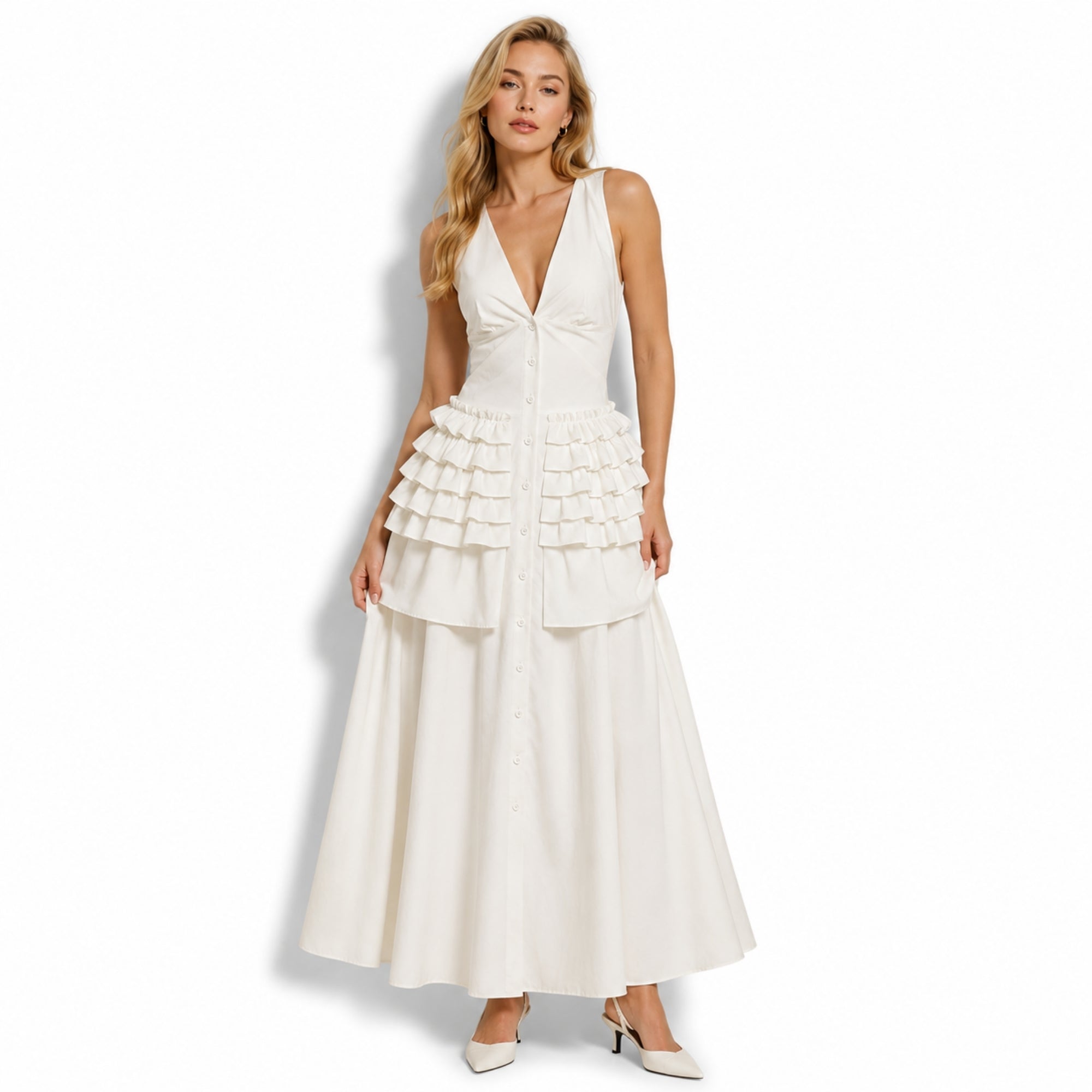 Studio shot of Kouvr white button-down tiered ruffle vacation dress showcasing the flattering v-neckline and full skirt.