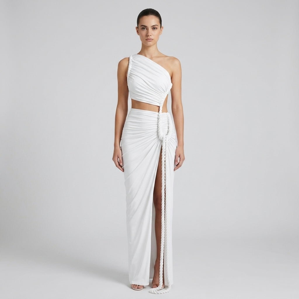 Front view of the Kouvr white one shoulder cutout ruched maxi dress featuring a distinctive thick rope tie and high leg slit on a female model.
