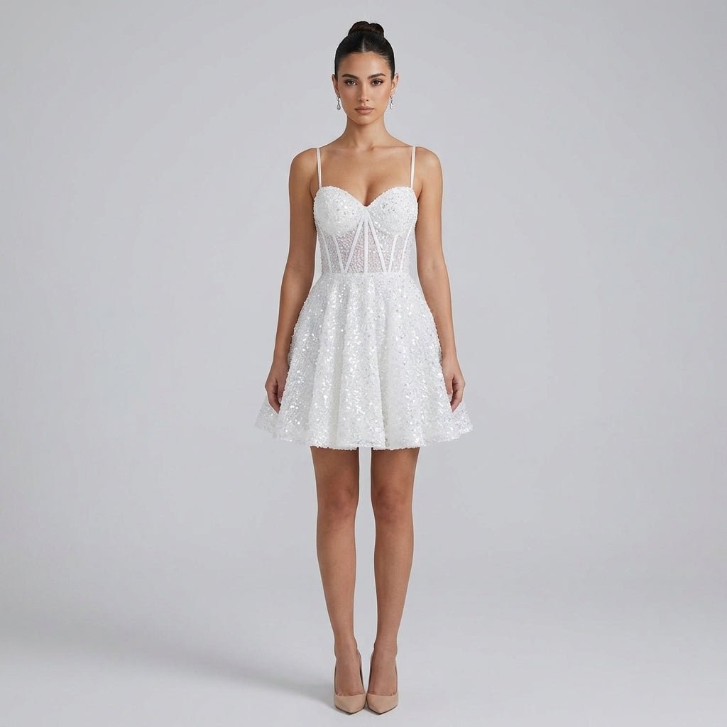 Woman wearing Kouvr white sequin corset mini dress with sweetheart neckline and flared skater skirt