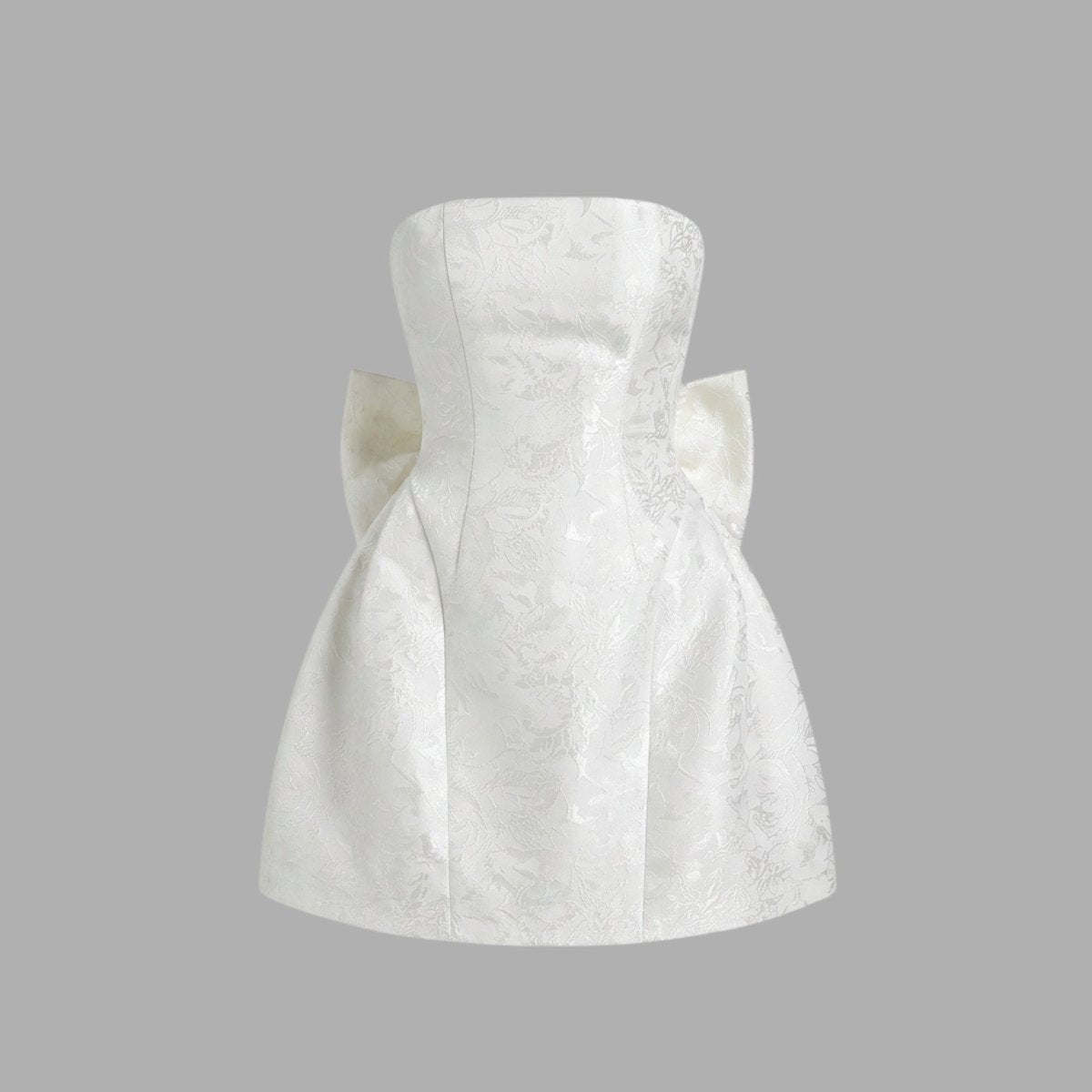 Ghost mannequin front view of white strapless floral jacquard mini dress with subtle waist seaming