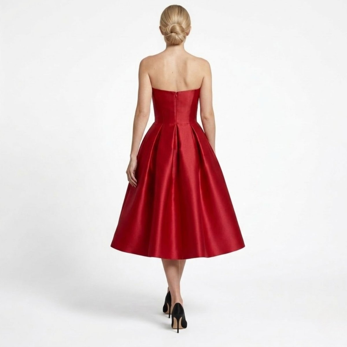 Back view of woman modeling wine red satin strapless midi dress showing invisible back zipper and tailored fit