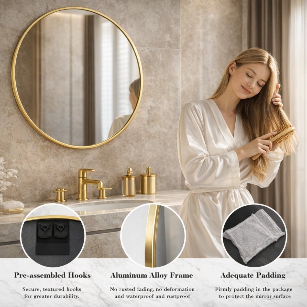 A woman in a white silk outfit smiles while applying mascara, her clear reflection shown in the Kouvr Aurora round gold mirror in a marble bathroom.