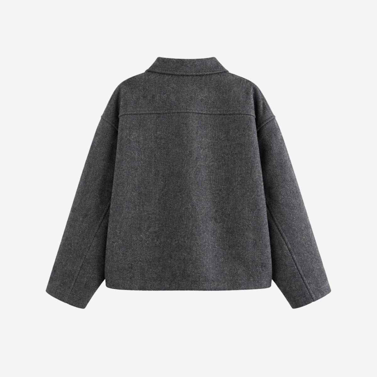 Flat lay of the back of a grey wool jacket showing the structured back yoke seam detail and boxy hem.