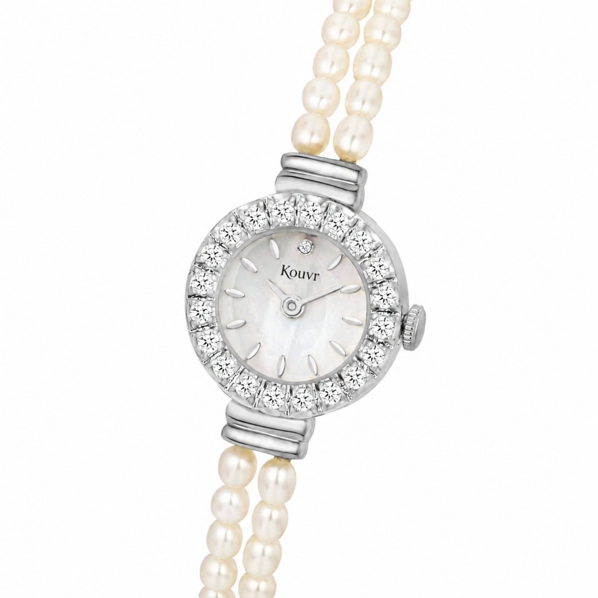 Angled close up view of the elegant silver tone women's watch showcasing the scratch resistant crystal glass depth and delicate pearl bracelet strap details.