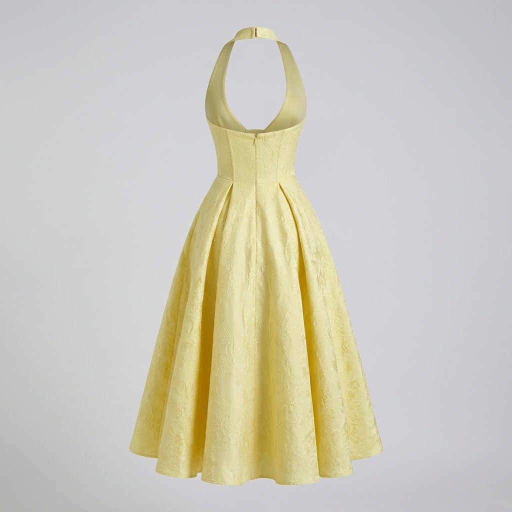 Ghost mannequin back view of the yellow halter neck dress showing the open back design and hidden zipper closure.