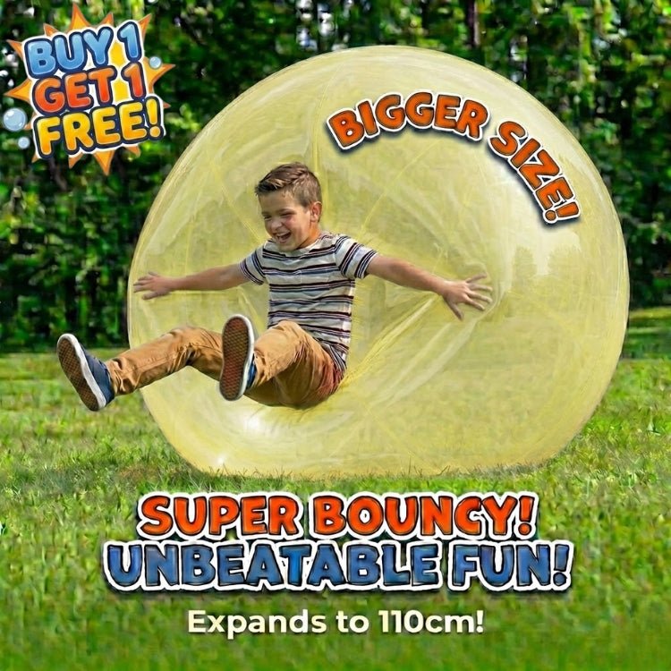 A smiling boy bouncing on a yellow giant bubble ball that expands to 110cm, featuring text about the buy one get one free special offer.