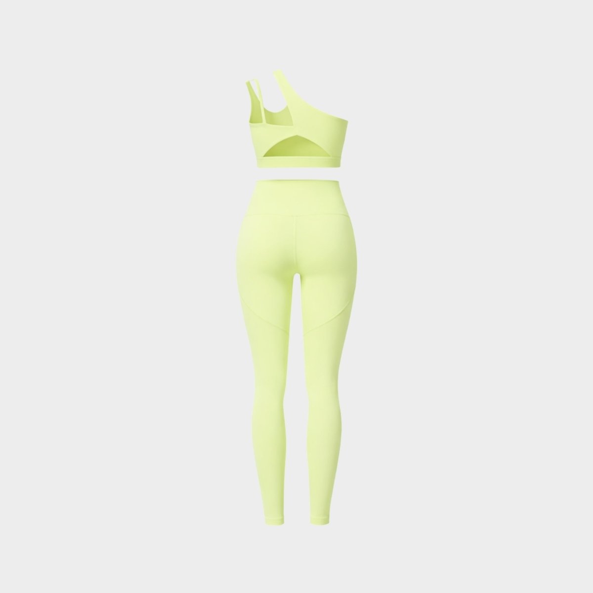 Ghost mannequin back view of Kouvr neon yellow activewear set highlighting asymmetrical back strap cutout details